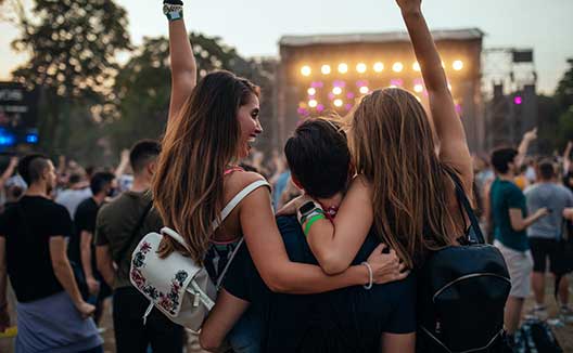 group of friends at an outdoor concert