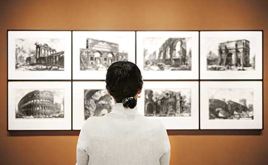 woman at museum looking at art